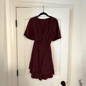 New, never worn! Burgundy, v- neck dress, with bow in back.
